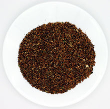 Load image into Gallery viewer, Our “Organic Iced Tropical” tea is an herb &amp; fruit blend that is made with only premium luxury ingredients imported from Thailand, Spain, Canada, and USA.  This tea&#39;s infusion is tempered orange and has a predominant orange character with the lovely sweetness of pineapple taste.   It comes in a large 1.25 oz. (30 g) bag that conveniently makes a large gallon of delicious iced tea. 
